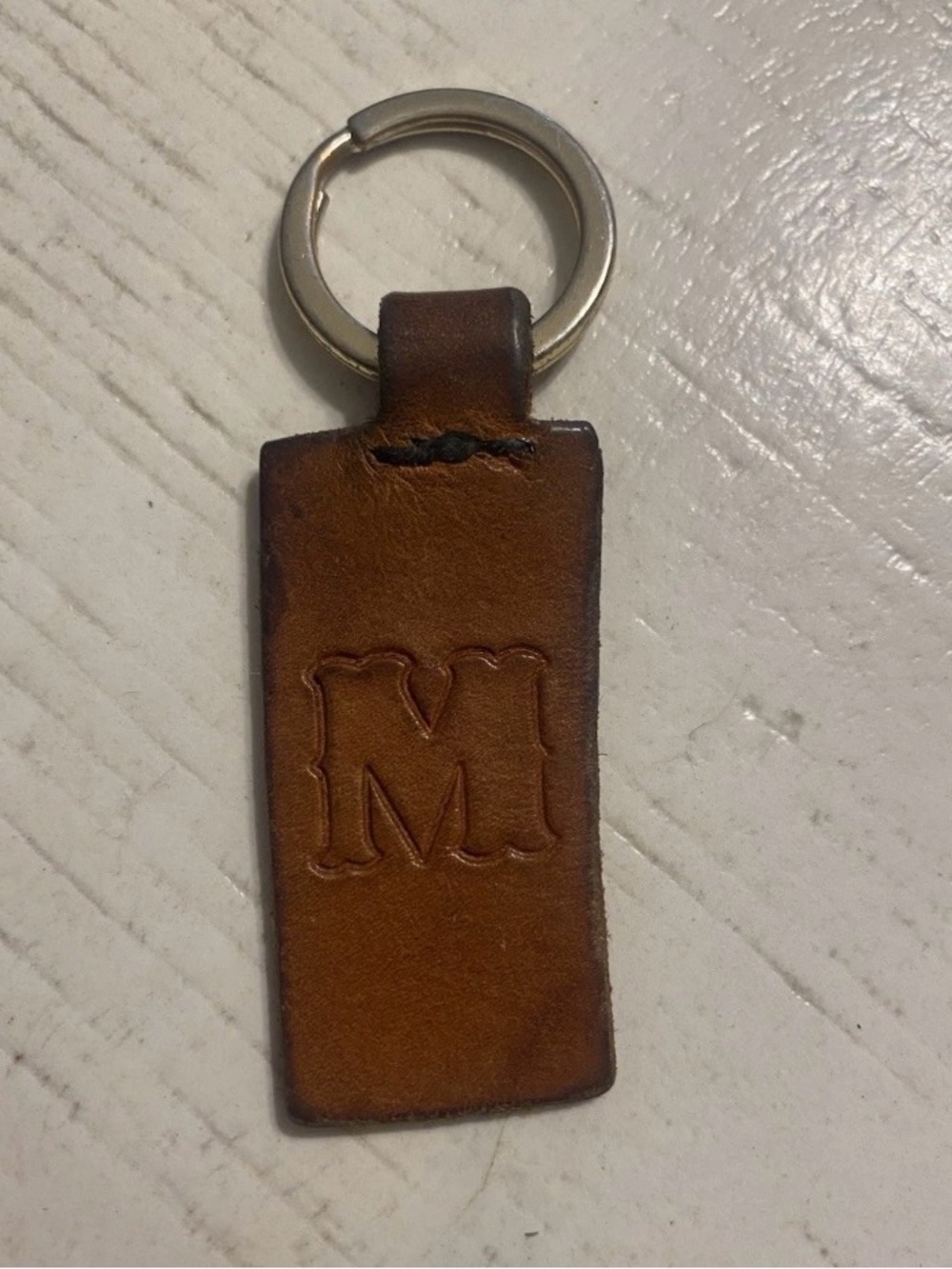 Authentic Brown Leather western embossed stamped “M” keychain